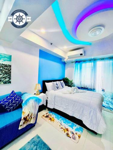 Malate Hotel | Ocean theme Navy Blue Deluxe Suite with PS4 and Balcony overlooking Manila Bay and Manila Zoo plus near Manila Yacht Club and Star City