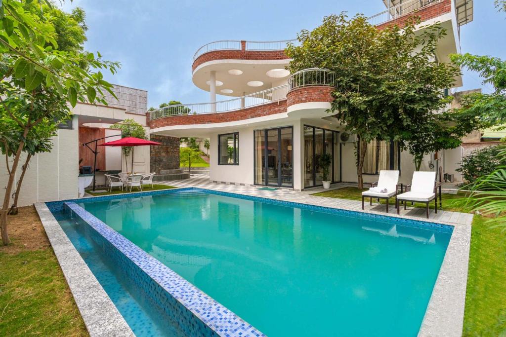 Jaipur Villa | StayVista's The Tree House - City-Center Villa with Outdoor Pool, Spacious Balconies & Vast Lawn