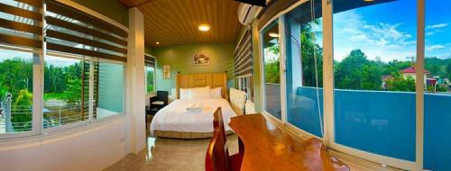 Lemery Hotel | TUBURAN Poolside