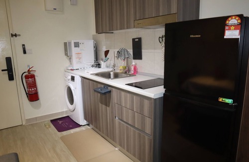 Cyberjaya Apartment | AIMIN HOMESTAYnCozy studio in peaceful Cyberjaya with WiFi, AC, fitness room