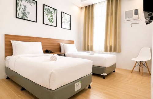 Puerto Princesa City Centre Hotel | Bambu Suites