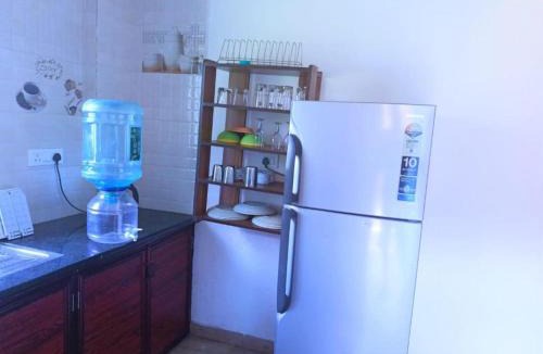 Mulgao Hotel | Blue building Service Apartments and kitchen Facility