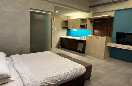 Kaunlaran Apartment | Cozy Spacious Pet Friendly Unit with Netflix Pool Gym