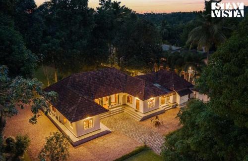 Tiruvalla Villa | CVM House with Lawn at Thiruvalla by StayVista