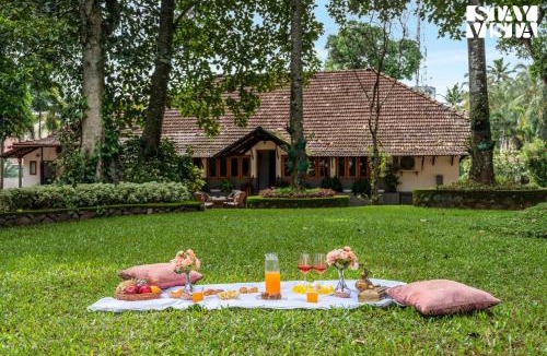 Tiruvalla Villa | CVM House with Lawn at Thiruvalla by StayVista