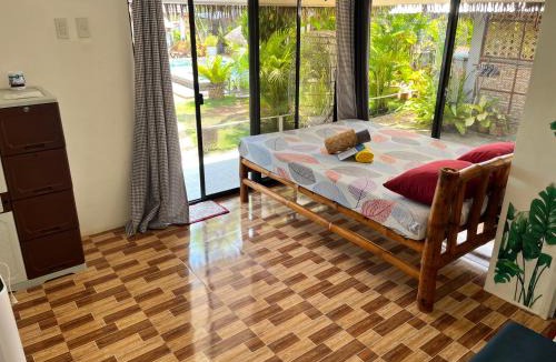 Poro Resort | La Provinzia Exclusive Use - 3 Air-Conditioned Rooms 3 Fan Cooled Huts Good for 12 People