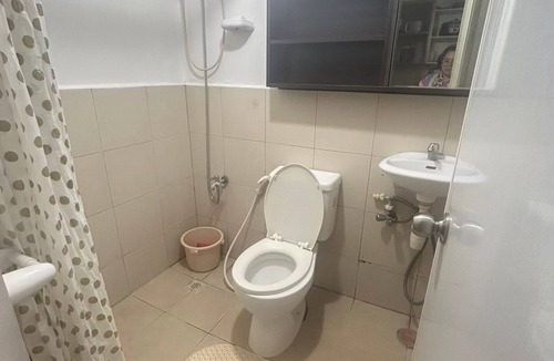 Imus Condo | Minimalist Room in Imus Condo with netflix and round-clock Security