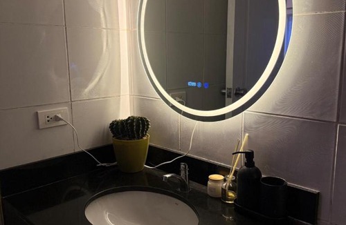 Moonwalk Apartment | Modern lounge 2BR Pool & Netflix Near airport