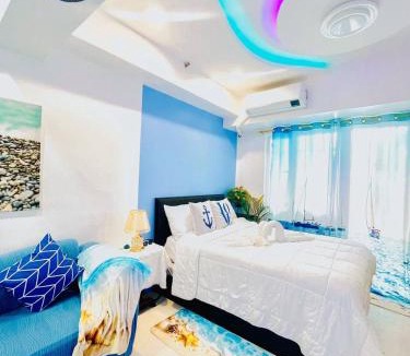 Malate Hotel | Ocean theme Navy Blue Deluxe Suite with PS4 and Balcony overlooking Manila Bay and Manila Zoo plus near Manila Yacht Club and Star City
