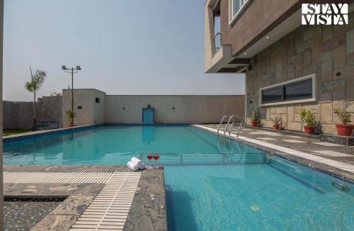 Sitapura Villa | StayVista at Pinkal Farms with Pool, Lawn, Wi-Fi