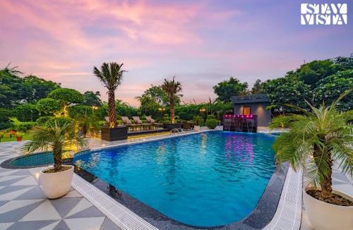 Faridabad Villa | StayVista's Hampton Acres - Outdoor Pool, Vast Lawn & Terrace