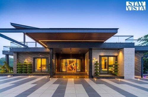 Faridabad Villa | StayVista's Hampton Acres - Outdoor Pool, Vast Lawn & Terrace