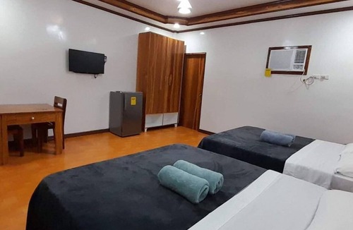 Catangnan Resort | Takbo Beach Resort - Cabana 2- Two Queen Size Beds with amenities