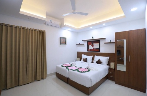 Thampanoor House | Welcome to our exquisite hotel suits nestled in the heart of Trivandrum
