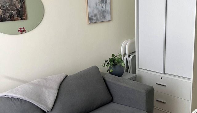 Cozy condo with AC and fitness room in lovely Dumaguete steps from the Ocean