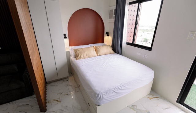 Minimalist 1-BR condo with balcony at Royal Oceancrest Mactan Cebu