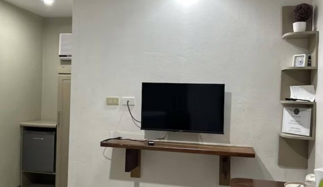 Serene Getaway in Dauis with Pool and Shared Kitchenette