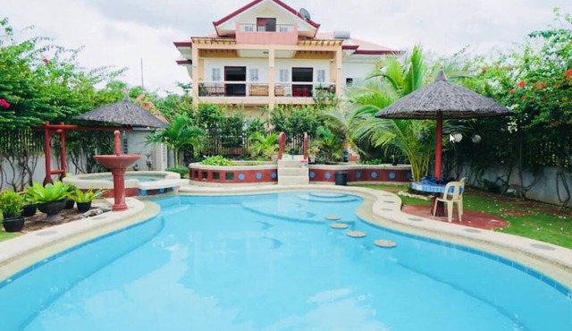 Spacious 5-bedroom Panglao Home with FREE transfers, Infinity Pool, WiFi, & A/C