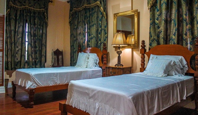 Treasure Bay Dive Resort is set between a scenic forest view and vast calm sea.
